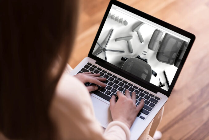 Watching assembly of ergohuman chair on laptop
